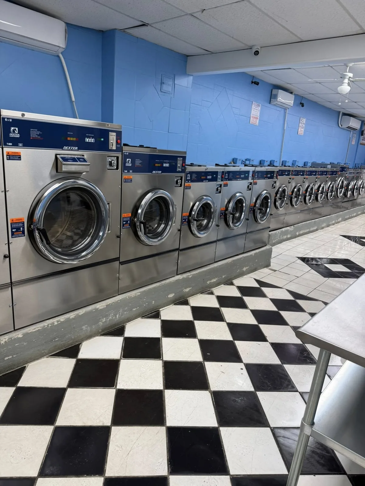 Clean row of modern laundromat machines