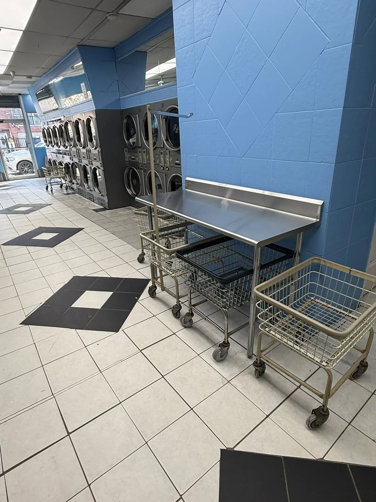 Folding area and laundry carts